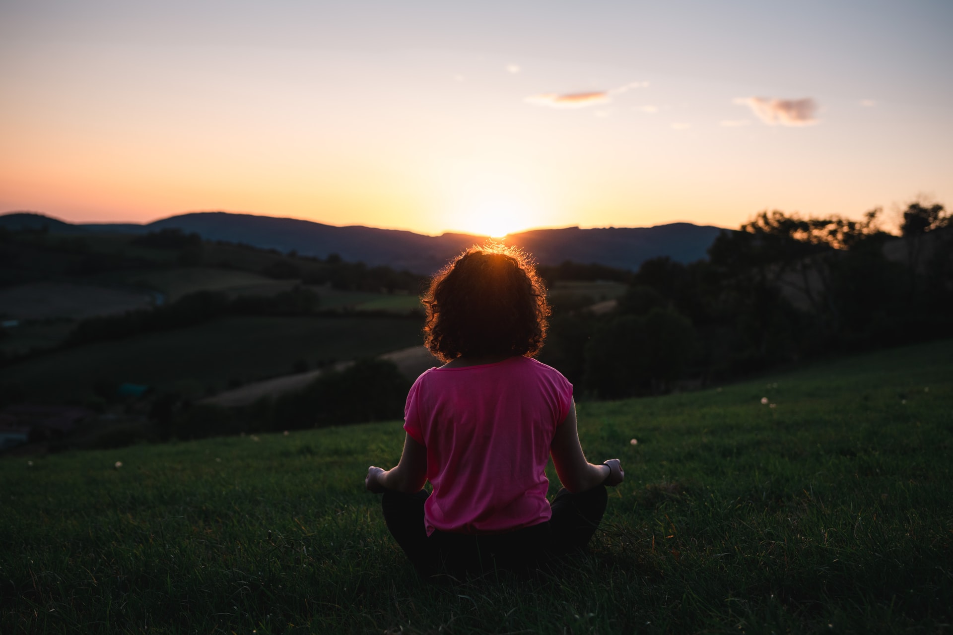 woman meditating outside